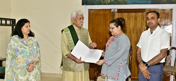 LG J&K hands over assurance letter to Daughter of Raj Thappa, to be appointed as  Law Officer after completion of Studies