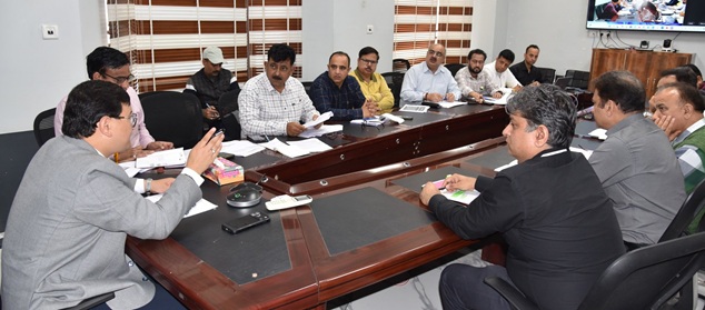 ' Minga Sherpa, chairs a review meeting on infrastructure damage'