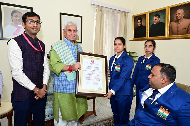 LG J&K presents Certificate of Excellence Award to Para Archers Ms Sheetal Devi, Sh Rakesh Kumar and Coach, Ms Abhilasha Choudhary