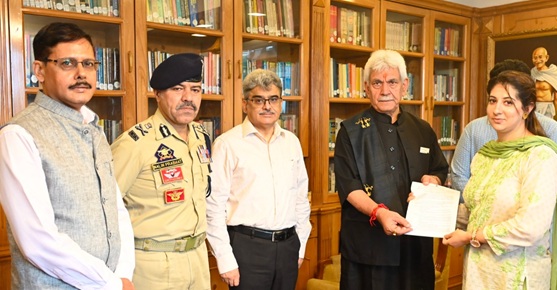'LG J&K  hands-over appointment letters to Wife of Martyr  Inspector Masroor Wani, Son of Martyr HC Ashiq Qureshi'